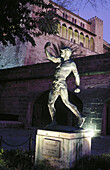 Statue and Almudaina Palace at night, Palma de Mallorca. Majorca, Balearic Islands. Spain