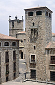 Palacio de los Golfines de Abajo (13th-15th c.) and Procathedral of Santa Maria in background. Cáceres. Spain.
