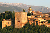 Alhambra in Granada against Mulhacén peaks in the evening. Granada. Andalucia. Spain.