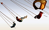 Girl in swing, carnival ride