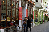Two women entering a cafe, Hamburg, Germany