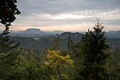 View over forest to mount Lilienstein and Neuratener rocks faces, Saxon Switzerland, Elbsandsteingebirge, Saxony, Germany, Europe