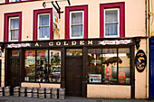 Pub with beer barrels in Macroom, County Cork, Ireland, Europe