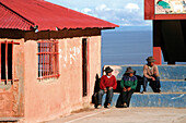 Men on Isla Amantani, Lake Titicaca, Peru