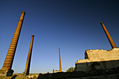 Smokestacks of abandoned factory. Epila, Zaragoza province. Aragón, Spain