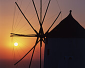 windmill, sunset, Oia city, Santorini island, Cyclades, Greece