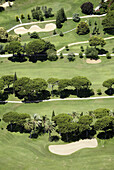 Aerial view, Aerial views, Color, Colour, Contemporary, Daytime, Exterior, Golf, Golf course, Golf courses, Green, Nature, Outdoor, Outdoors, Outside, Sport, Sports, Tree, Trees, Vegetation, View from above, S73-489071, agefotostock