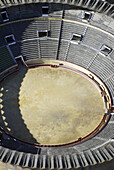 Aerial view, Aerial views, Animal, Animal abuse, Animals, Architecture, Bull, Bull-ring, Bull-rings, Bullfight, Bullfighting, Bullfights, Bullring, Bullrings, Bulls, Color, Colour, Daytime, Exterior, One, One animal, Outdoor, Outdoors, Outside, Sand, Trad