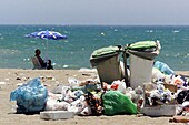 Garbage on a beach, Costa del Sol. Málaga province, Andalusia, Spain