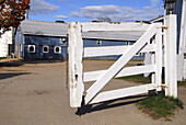 Weathered gate at entrance to horse stable, Stanhope Stables in Huntington, NY. USA