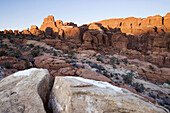 Sandstone fins catch the last rays of winter sunlight in the Fiery Furnace, Arches National Park, Utah, USA.