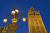 Street lamp and Giralda tower, Sevilla. Andalusia, Spain