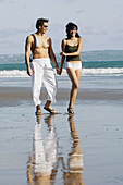couple sightseeing on beach