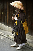Shinto monk begging, Japan