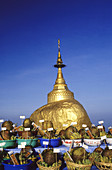 Offerings at the golden rock. Myanmar