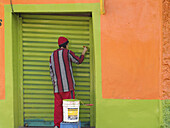 Man painting a colorful house. Santiago. Chile