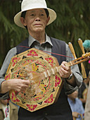 musician with traditional banjo, Kunming, China