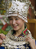 girl in silver hat, traditional wear, Lijiang, China