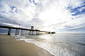 Huntington Pier on Pacific Ocean at Huntington Beach, near Los Angeles California. USA.