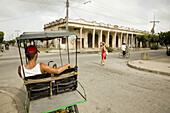Street scene. Pedicab waiting for costumers. Avenida de los Mártires. Camagüey. Cuba.