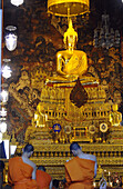 Monks praying in Wat Po, Bangkok, Thailand