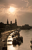 Europe, Germany, Saxony, Dresden, Skyline of Dresden with Brühlsche terrace, Residenzschloss, Ständehaus, Haussman Tower and Catholic Court Church and Semper Opera seen from Carola bridge on Elbe River