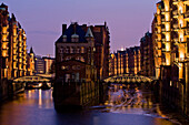 Bridges over canal at night, Speicherstadt, Hamburg, Germany