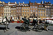 Poland Warsaw, The Old Town ( Stare Miasto ) Square, Partially surrounded by medieval walls is the oldest district in Warsaw, from 13 century, Then main section of Warsaw, Now main tourist attraction with carriages cafes restaurants and shops