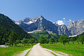wide path in alpine pasture leading towards mountain range, Großer Ahornboden, Eng, Karwendel range, Tyrol, Austria