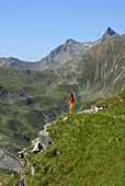 young woman hiking, Zinseler, Sarntal range, South Tyrol, Alta Badia, Italy