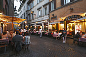 Restaurants and pavement cafes along cobblestone land, Trastevere, Rome, Italy