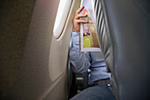 Man reading in plane