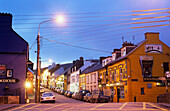 Illuminated street in the evening, Dingle, County Kerry, Ireland, Europe