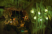 Figures in an illuminated grotto, Grottenbahn, Linz, Upper Austria, Austria