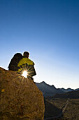 Woman resting on a rock, Teide National Park, Tenerife, Canary Islands, Spain