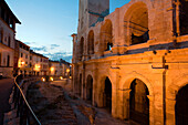 The illuminated amphitheatre in the evening, Arles, Bouches-du-Rhone, Provence, France