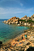 Italy Sardinia Capo Testa Cala Spinosa, sand beach with cristal clear water surrounded by bizarre rocks