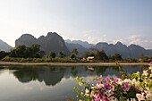 Karst mountains at the river Nam Xong in the sunlight, Vang Vieng, Vientiane Province, Laos