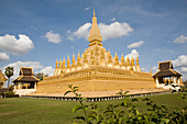 Buddhistic stupa Pha That Luang under blue sky, national symbol and religious monument in Vientiane, capital of Laos