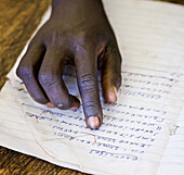 Boy's hand at school. Ethiopia