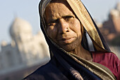 Woman and Taj Mahal in background, Agra. Uttar Pradesh, India