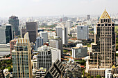 Elevated View of Modern Buildings of Bangrak District and Lumphini Park looking North West, Bangkok. Thailand