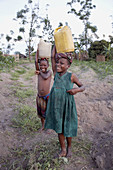Girls carrying buckets of water, Kalabezo. Tanzania