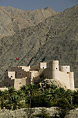 OMAN-Western Hajar Mountains-Nakhl: Distant View of Nakhl Fort