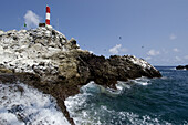 Seawater flowing and lighthouse, St. Peter and St. Paul's rocks, Brazil, Atlantic Ocean
