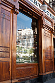 Plaza de Santa Ana with reflection of Reina Victoria Hotel, Madrid, Spain