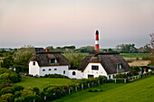 Thatched House and Lighthouse, Pellworm Island, North Frisian Islands, Schleswig-Holstein, Germany