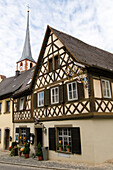 Exterior view of the Restaurant Ehrbars Fränkische Weinstube under cloudy sky, Frickenhausen, Franconia, Bavaria, Germany