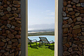 View at deck chairs and pool over the Walker Bay, Gansbaai, South Africa, Africa