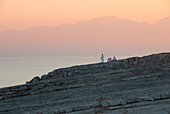 Locals at the coast at dusk, Musandam, Oman, Asia